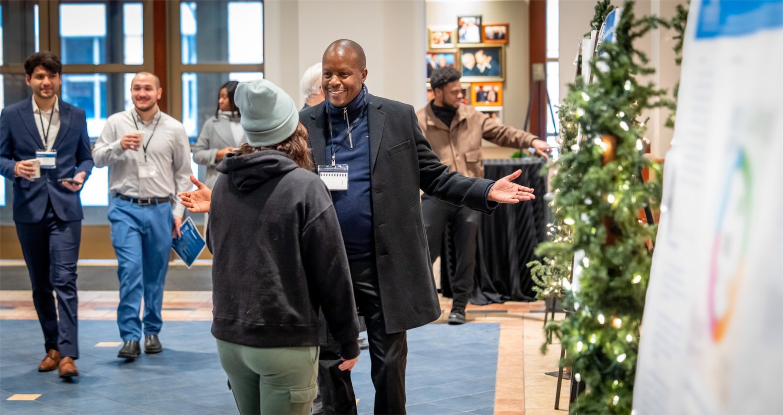 Faculty, students, and guests talking on the Innovation Day floor